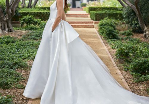 Model in white ball gown wedding dress with pockets