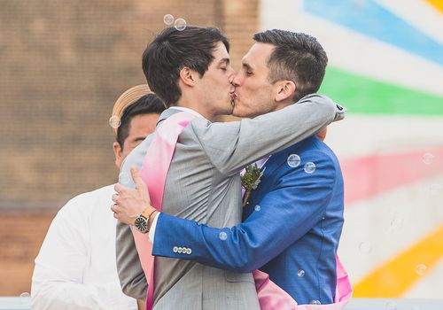 Grooms kissing