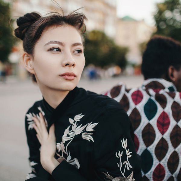 a couple with their backs to each other