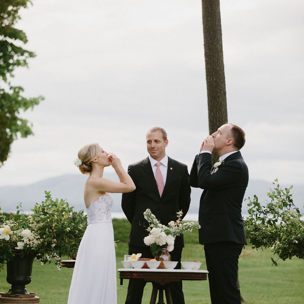Bride and groom drinking at ceremony