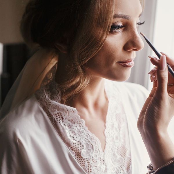 bride getting makeup done
